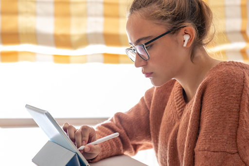 a student studying from ipad